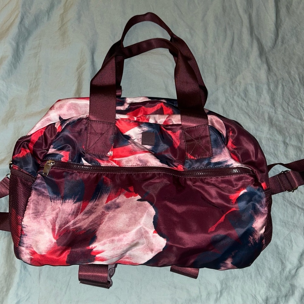 JoyLab Red and Pink Travel Bag with Artistic Floral Design